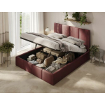 Bordeauxfarbenes Polsterbett im Schlafzimmer